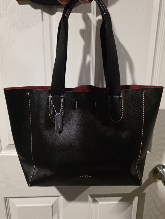 Coach Handbags - Coach Derby Tote Bag in black pebbled leather with a contrasting red interior.